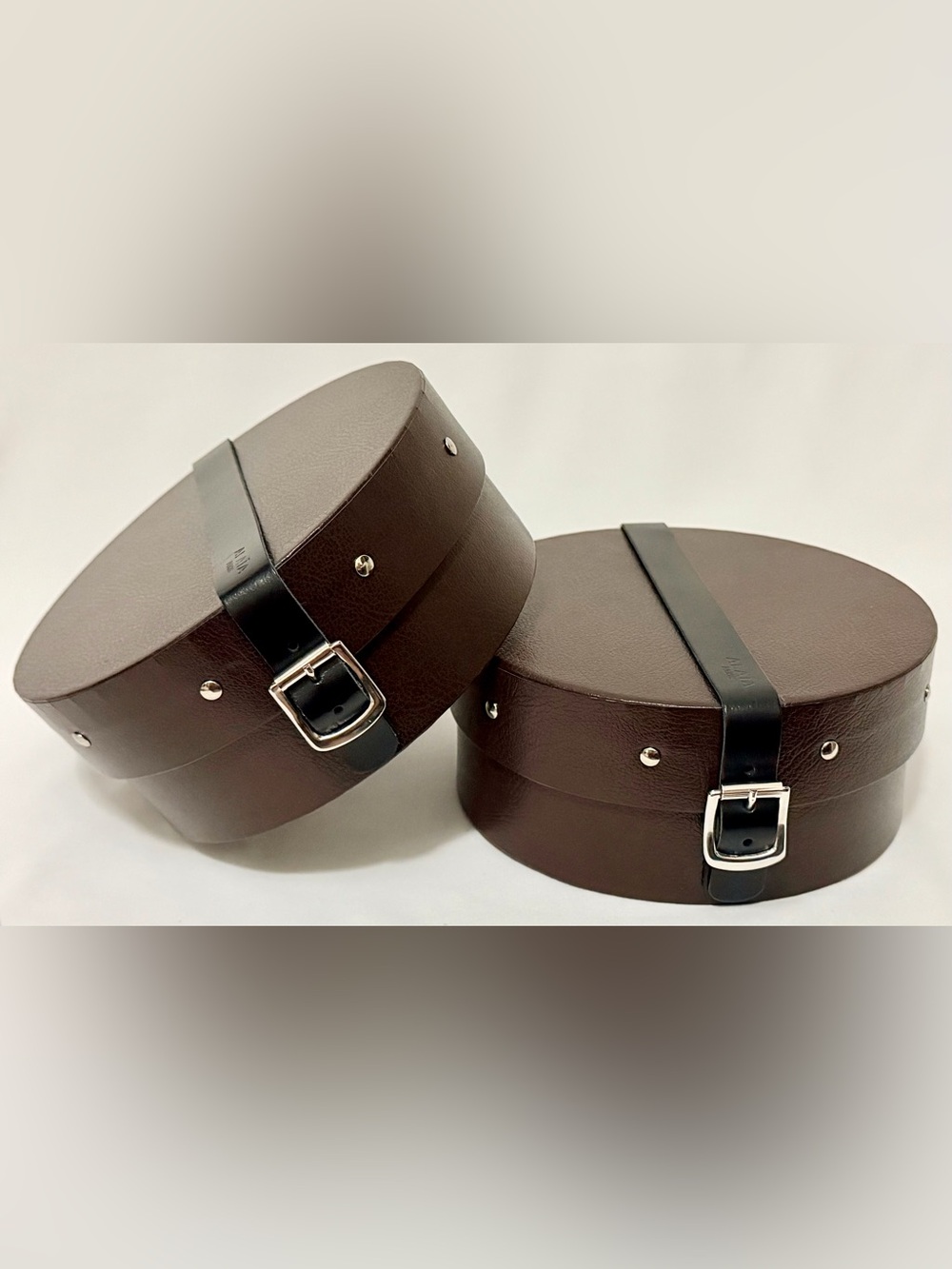 Alaia Paris Round Storage Cases Set of 2 Brown Buckle Strap Vanity Luxury Decor